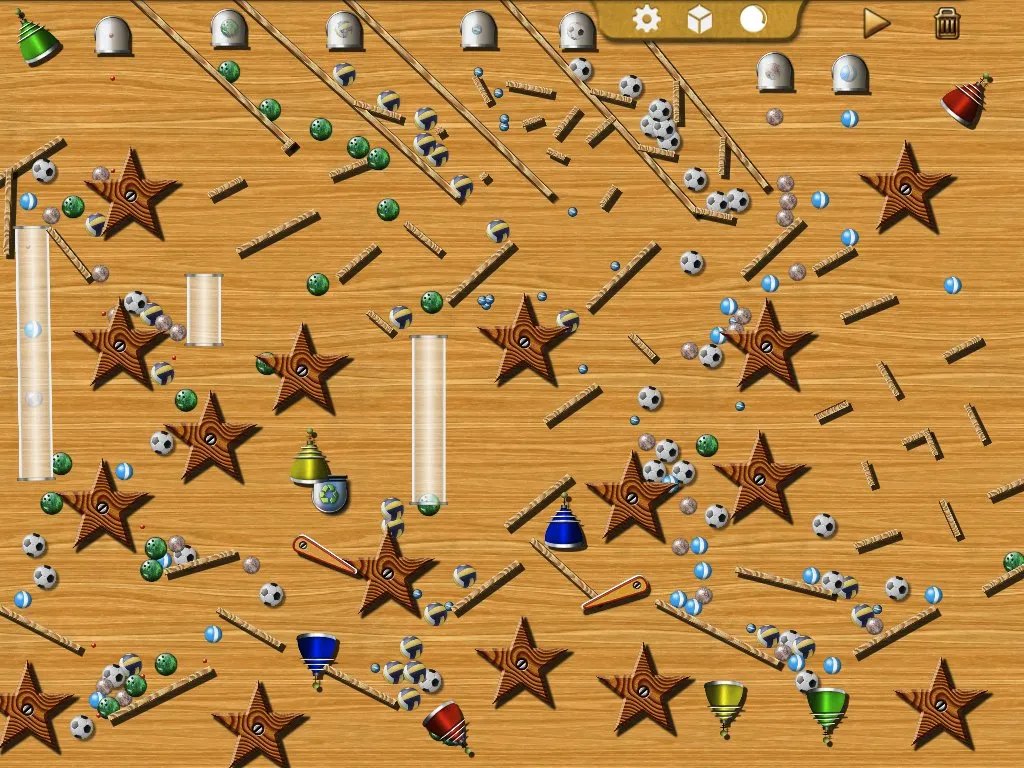A dense machine of ramps, spinners and tubes with hundreds of balls in motion at once.
